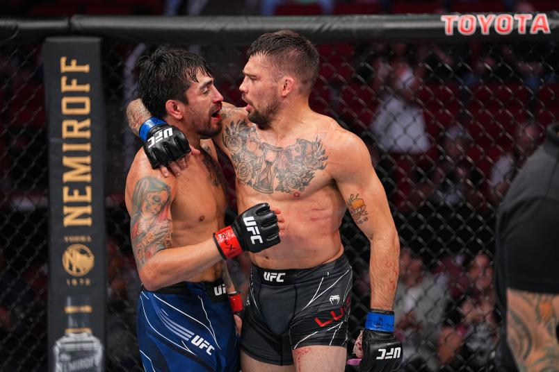 Tucker Lutz embraces Kevin Aguilar after their featherweight bout during the UFC 262 event at Toyota Center on May 15, 2021 in Houston, Texas. (Photo by Josh Hedges/Zuffa LLC)