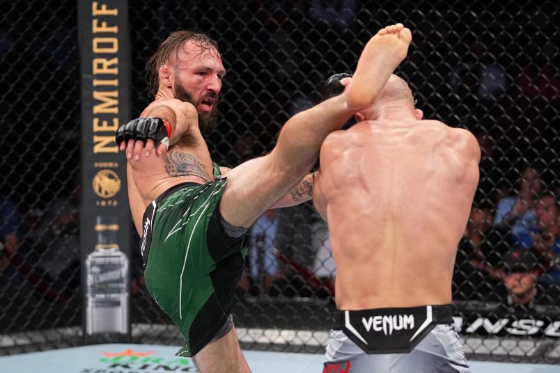 Lando Vannata kicks Mike Grundy of United Kingdom in their featherweight bout during the UFC 262 event at Toyota Center on May 15, 2021 in Houston, Texas. (Photo by Josh Hedges/Zuffa LLC)