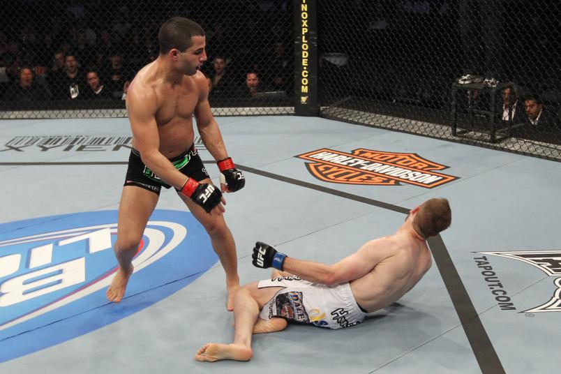 John Makdessi (L) knocks out Kyle Watson with a spinning back punch to win in round three during their Lightweight bout at UFC 129 in the Rogers Centre on April 30, 2011 in Toronto, Ontario. (Photo by Al Bello/Zuffa LLC)