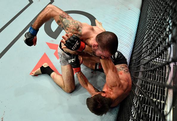 att Brown punches Carlos Condit in a welterweight bout during the UFC Fight Night event at Etihad Arena on UFC Fight Island on January 17, 2021 in Abu Dhabi, United Arab Emirates. (Photo by Jeff Bottari/Zuffa LLC)