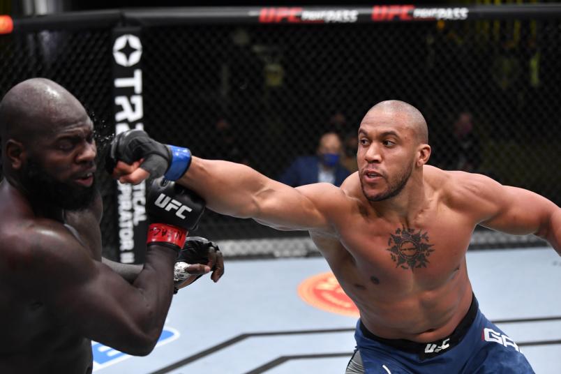 Ciryl Gane of France punches Jairzinho Rozenstruik of Suriname in a heavyweight bout during the UFC Fight Night event at UFC APEX on February 27, 2021 in Las Vegas, Nevada. (Photo by Jeff Bottari/Zuffa LLC)
