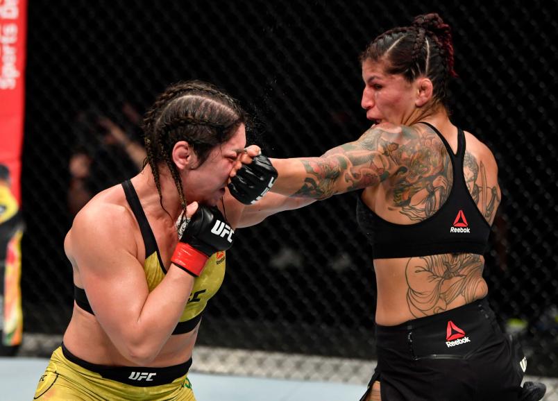 Pannie Kianzad of Iran punches Bethe Correia of Brazil in their bantamweight fight during the UFC Fight Night event inside Flash Forum on UFC Fight Island on July 26, 2020 in Yas Island, Abu Dhabi, United Arab Emirates. (Photo by Jeff Bottari/Zuffa LLC via Getty Images)