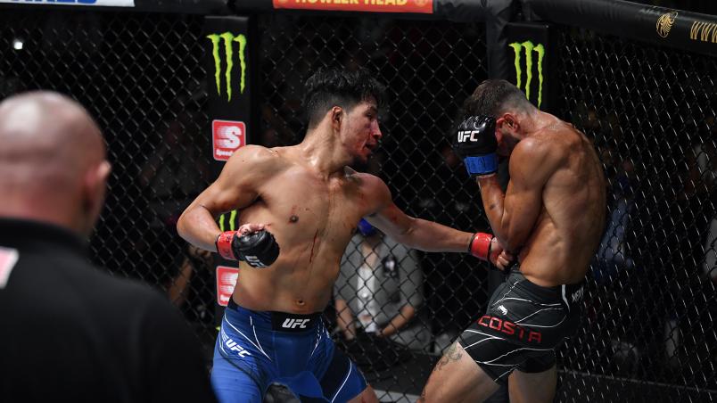 Adrian Yanez punches Randy Costa in their bantamweight fight during the UFC Fight Night event at UFC APEX on July 24, 2021 in Las Vegas, Nevada. (Photo by Jeff Bottari/Zuffa LLC)