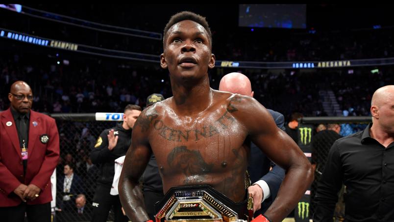 Israel Adesanya of Nigeria celebrates after defeating Yoel Romero of Cuba in their UFC middleweight championship fight during the UFC 248 event at T-Mobile Arena on March 07 2020 in Las Vegas Nevada. (Photo by Jeff Bottari/Zuffa LLC)