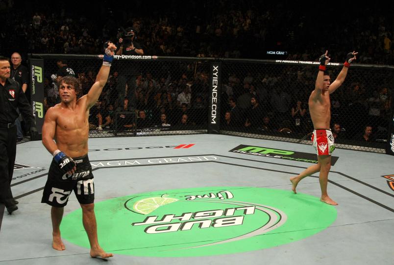 Urijah Faber and Dominick Cruz both celebrate after their hard-fought five-round fight for the UFC Bantamweight Championship at UFC 132 at MGM Grand Garden Arena on July 2, 2011 in Las Vegas, Nevada. (Photo by Donald Miralle/Zuffa LLC)