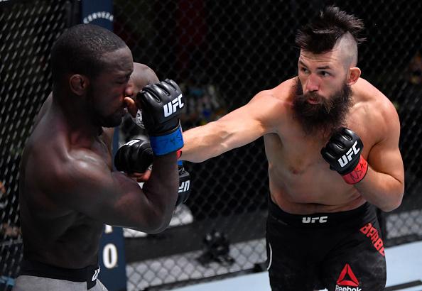 Bryan Barberena punches Anthony Ivy in a welterweight fight during the UFC Fight Night event at UFC APEX on September 12, 2020 in Las Vegas, Nevada. (Photo by Jeff Bottari/Zuffa LLC)