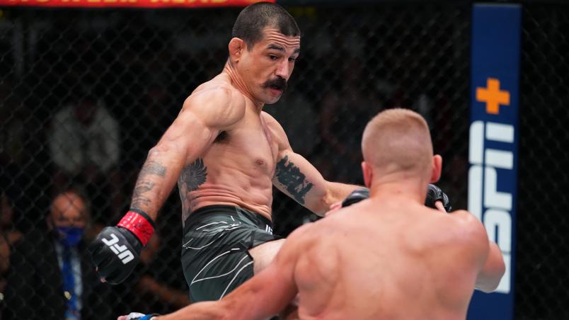 Vinc Pichel kicks Austin Hubbard in their lightweight matchup at UFC Fight Night: Cannonier vs Gastelum on August 21 2021 in Las Vegas Nevada (Photo by Chris Unger/Zuffa LLC)