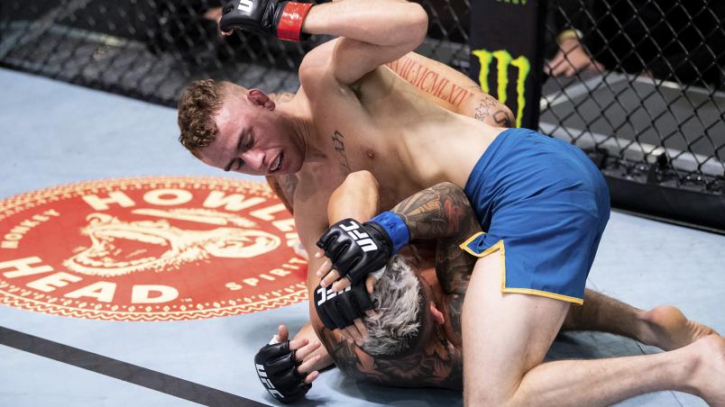 Brady Hiestand punches Vince Murdock in their bantamweight fight on The Return of The Ultimate Fighter (photo by Chris Unger/Zuffa LLC)