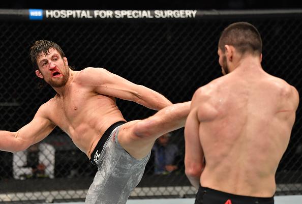 Andrew Sanchez kicks Makhmud Muradov of Uzbekistan in a middleweight fight during the UFC 257 event inside Etihad Arena on UFC Fight Island on January 23, 2021 in Abu Dhabi, United Arab Emirates. (Photo by Jeff Bottari/Zuffa LLC)
