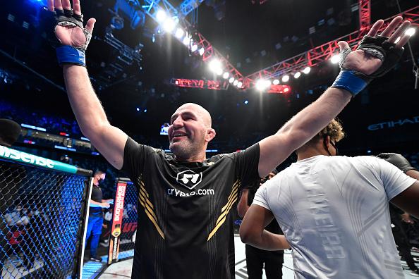 Glover Teixeira of Brazil celebrates after his victory over Jan Blachowicz of Poland in the UFC light heavyweight championship fight during the UFC 267 event at Etihad Arena on October 30 2021 in Yas Island Abu Dhabi United Arab Emirates. (Photo by Chris Unger/Zuffa LLC)