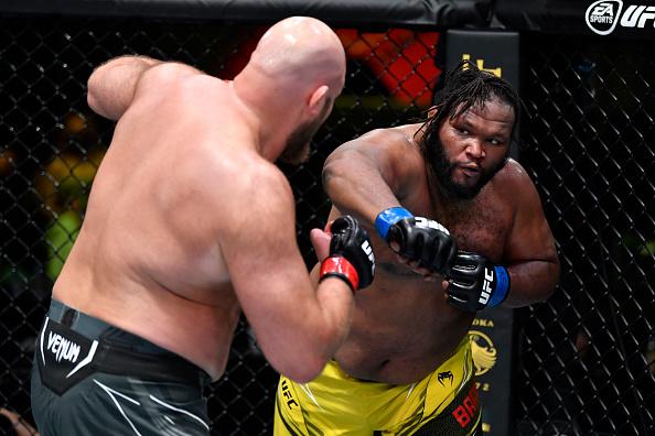 Chris Barnett punches Ben Rothwell in their heavyweight bout during the UFC Fight Night event at UFC APEX on May 22, 2021 in Las Vegas, Nevada. (Photo by Chris Unger/Zuffa LLC)