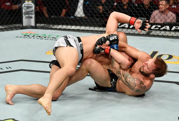 Brad Riddell of New Zealand works for a submission against Drew Dober in their lightweight fight during the UFC 263 event at Gila River Arena on June 12, 2021 in Glendale, Arizona. (Photo by Jeff Bottari/Zuffa LLC)