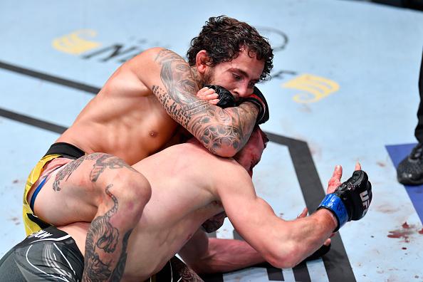 Marlon Vera of Ecuador secures a rear choke submission against Davey Grant of England in a bantamweight bout during the UFC Fight Night event at UFC APEX on June 19, 2021 in Las Vegas, Nevada. (Photo by Chris Unger/Zuffa LLC)
