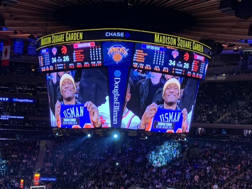 Kamaru Usman is featured on the Madison Square Garden Jumbotron holding his honorary Knicks jersey (Photo by Steve Latrell/Zuffa LLC)
