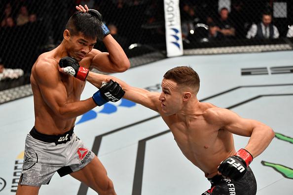 Kai Kara-France of New Zealand punches Tyson Nam in their flyweight bout during the UFC Fight Night event at Spark Arena on February 23, 2020 in Auckland, New Zealand. (Photo by Jeff Bottari/Zuffa LLC)