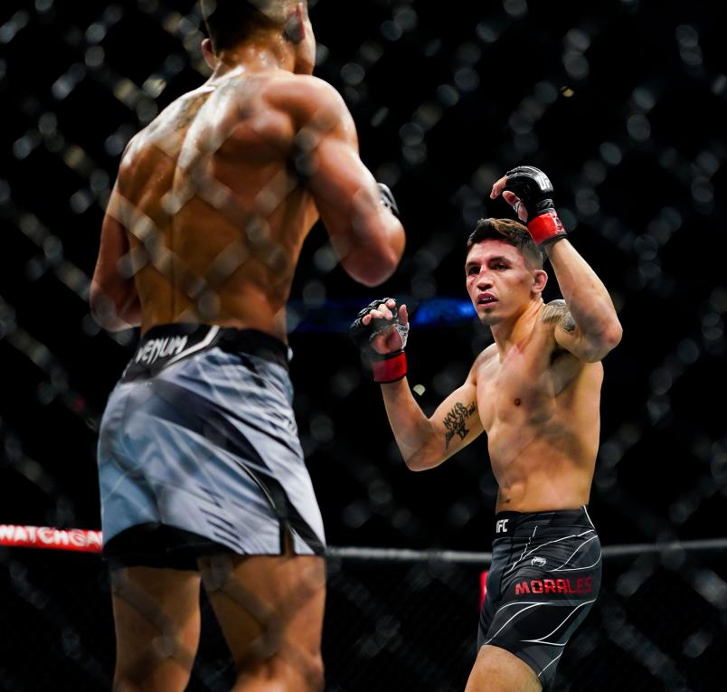 Vince Morales and Drako Rodriguez in the ring during the first round of their Bantamweight fight at Toyota Center on July 7, 2021 in Houston, Texas. (Photo by Alex Bierens de Haan/Getty Images )