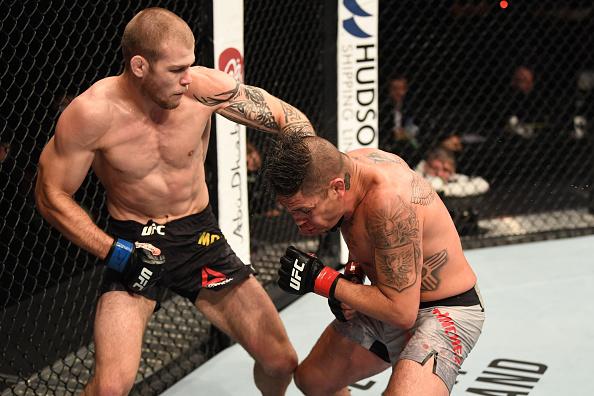 Jake Matthews of Australia punches Diego Sanchez in their welterweight bout during UFC 253 inside Flash Forum on UFC Fight Island on September 27, 2020 in Abu Dhabi, United Arab Emirates. (Photo by Josh Hedges/Zuffa LLC)