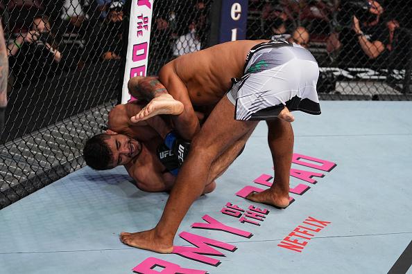 Andre Muniz attempts to submit Ronaldo Souza of Brazil in their middleweight bout during the UFC 262 event at Toyota Center on May 15, 2021 in Houston, Texas. (Photo by Josh Hedges/Zuffa LLC)