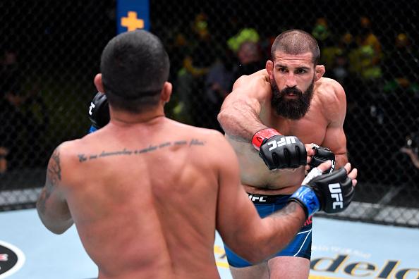 Court McGee punches Claudio Silva of Brazil in their welterweight bout during the UFC Fight Night event at UFC APEX on May 22, 2021 in Las Vegas, Nevada. (Photo by Chris Unger/Zuffa LLC)