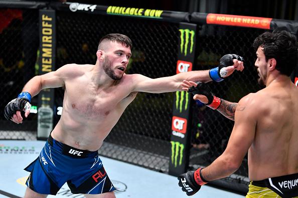 Bill Algeo punches Ricardo Ramos of Brazil in their featherweight bout during the UFC Fight Night event at UFC APEX on May 22, 2021 in Las Vegas, Nevada. (Photo by Chris Unger/Zuffa LLC)