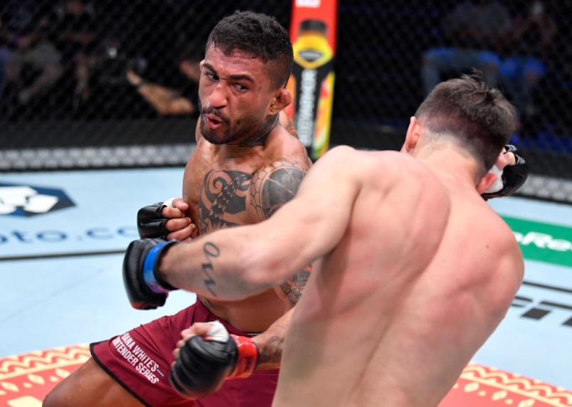 Joanderson Brito of Brazil punches Diego Lopes of Brazil in their featherweight fight during Dana White's Contender Series season five week one at UFC APEX on August 31, 2021 in Las Vegas, Nevada. (Photo by Chris Unger/Zuffa LLC)