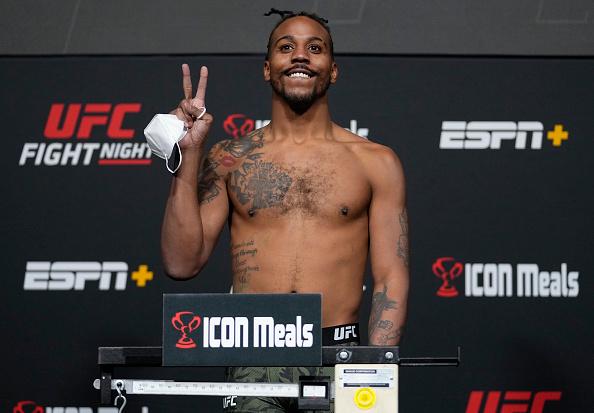 Joseph Holmes poses on the scale during the UFC Fight Night weigh-in at UFC APEX on January 14, 2022 in Las Vegas, Nevada. (Photo by Jeff Bottari/Zuffa LLC)