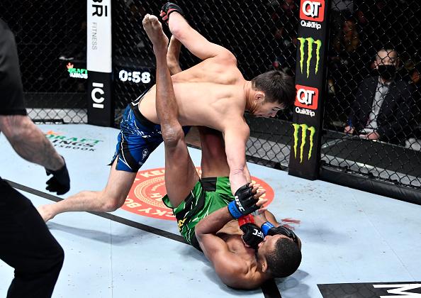 Shavkat Rakhmonov of Uzbekistan punches Carlston Harris of Guyana in their welterweight fight during the UFC Fight Night event at UFC APEX on February 05, 2022 in Las Vegas, Nevada. (Photo by Chris Unger/Zuffa LLC)