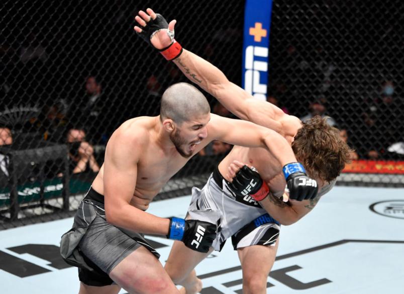 Bruno Souza of Brazil punches Melsik Baghdasaryan in their featherweight fight during the UFC 268 event at Madison Square Garden on November 06, 2021 in New York City. (Photo by Jeff Bottari/Zuffa LLC)