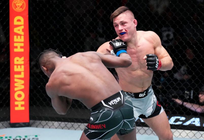 Drew Dober punches Terrance McKinney in their lightweight fight during the UFC Fight Night event at UFC APEX on March 12, 2022 in Las Vegas, Nevada. (Photo by Chris Unger/Zuffa LLC)