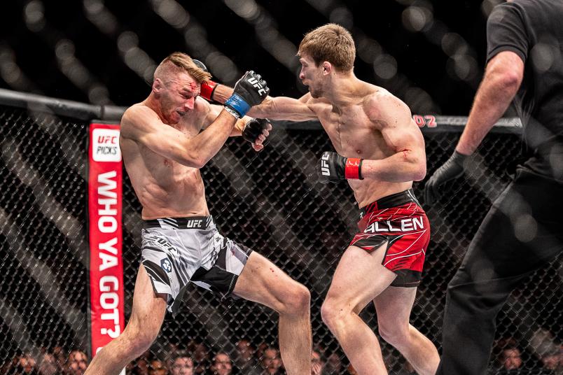 Arnold Allen punches Dan Hooker at O2 Arena on March 19, 2022 in London, England. (Photo by John Barry/Zuffa LLC)