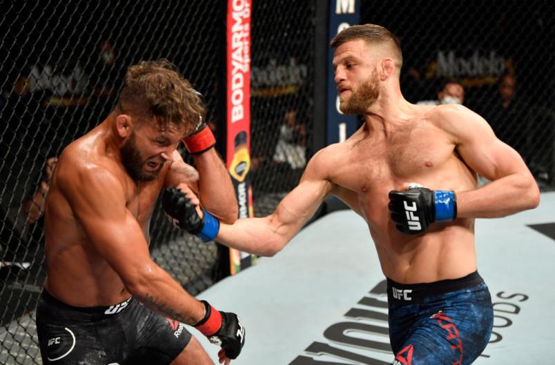 Calvin Kattar punches Jeremy Stephens in their featherweight fight during the UFC 249 event at VyStar Veterans Memorial Arena on May 09, 2020 in Jacksonville, Florida. (Photo by Jeff Bottari/Zuffa LLC)