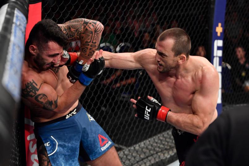Muslim Salikhov of Russia punches Laureano Staropoli of Argentina in their welterweight bout during the UFC Fight Night event at Singapore Indoor Stadium on October 26, 2019 in Singapore. (Photo by Jeff Bottari/Zuffa LLC via Getty Images)