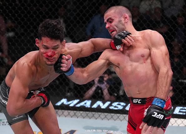 Andre Fialho of Portugal punches Miguel Baeza in a welterweight fight during the UFC Fight Night event at UFC APEX on April 16, 2022 in Las Vegas, Nevada. (Photo by Jeff Bottari/Zuffa LLC)