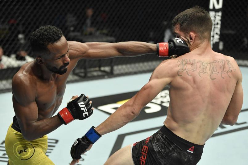 Francisco Figueiredo of Brazil punches Jerome Rivera in a flyweight fight during the UFC Fight Night event at Etihad Arena on UFC Fight Island on January 20, 2021 in Abu Dhabi, United Arab Emirates. (Photo by Jeff Bottari/Zuffa LLC via Getty Images)