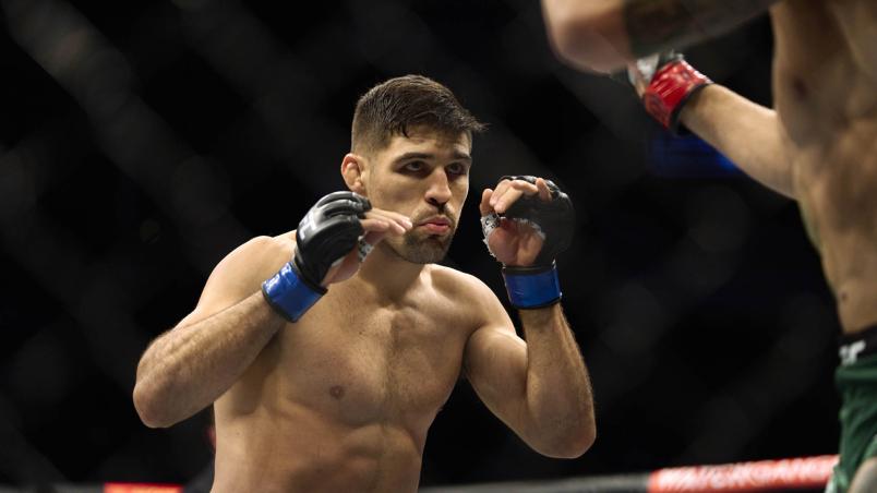 Vicente Luque of Brazil faces Michael Chiesa in their welterweight bout during the UFC 265 event at Toyota Center on August 07, 2021 in Houston, Texas. (Photo by Cooper Neill/Zuffa LLC)