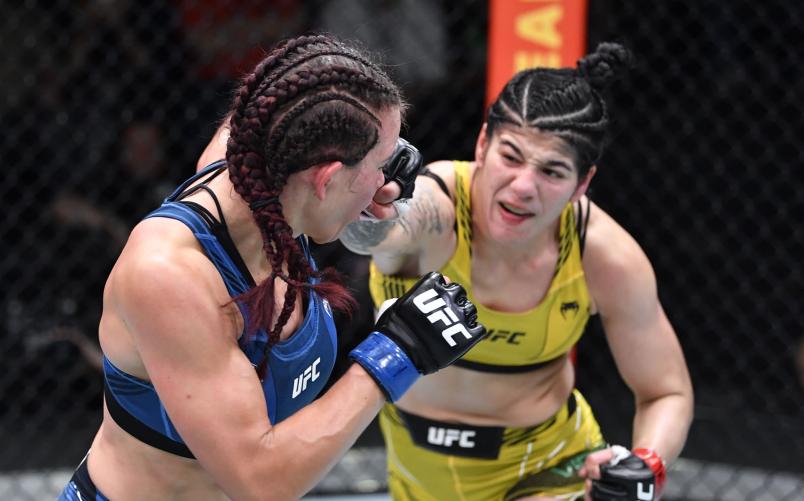 Ketlen Vieira of Brazil punches Miesha Tate in a bantamweight fight during the UFC Fight Night event at UFC APEX on November 20, 2021 in Las Vegas, Nevada. (Photo by Chris Unger/Zuffa LLC)