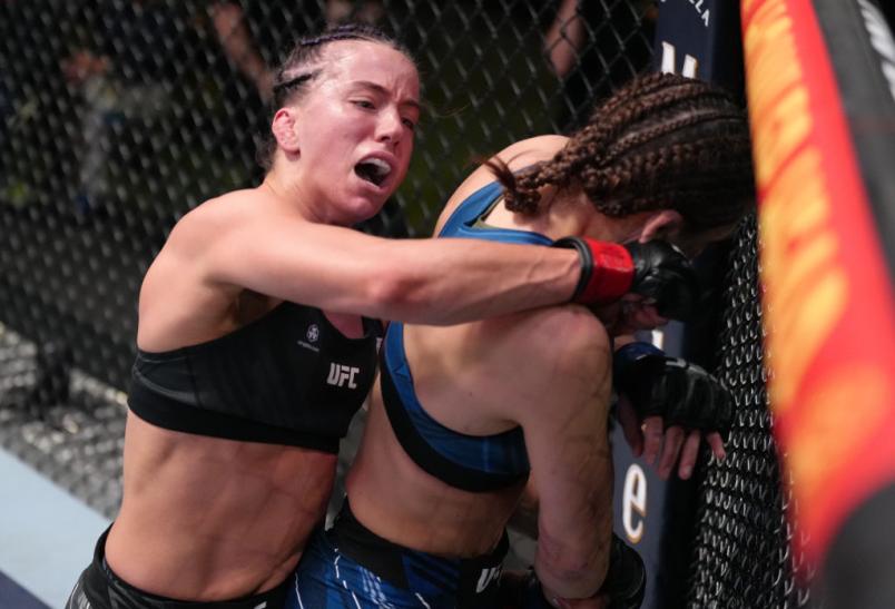 Maycee Barber punches Montana De La Rosa in a flyweight fight during the UFC Fight Night event at UFC APEX on April 23, 2022 in Las Vegas, Nevada. (Photo by Jeff Bottari/Zuffa LLC)