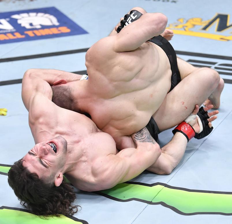 Michael Trizano attempts to secure a guillotine choke against Ludovit Klein of Slovakia in a featherweight fight during the UFC Fight Night event at UFC APEX on May 08, 2021 in Las Vegas, Nevada. (Photo by Chris Unger/Zuffa LLC)