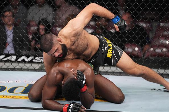 Jacob Malkoun of Australia punches AJ Dobson in their middleweight fight during the UFC 271 event at Toyota Center on February 12, 2022 in Houston, Texas. (Photo by Josh Hedges/Zuffa LLC)