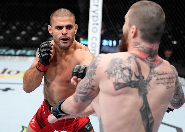 Andre Fialho of Portugal punches Cameron VanCamp in a welterweight fight during the UFC 274 event at Footprint Center on May 07, 2022 in Phoenix, Arizona. (Photo by Chris Unger/Zuffa LLC)