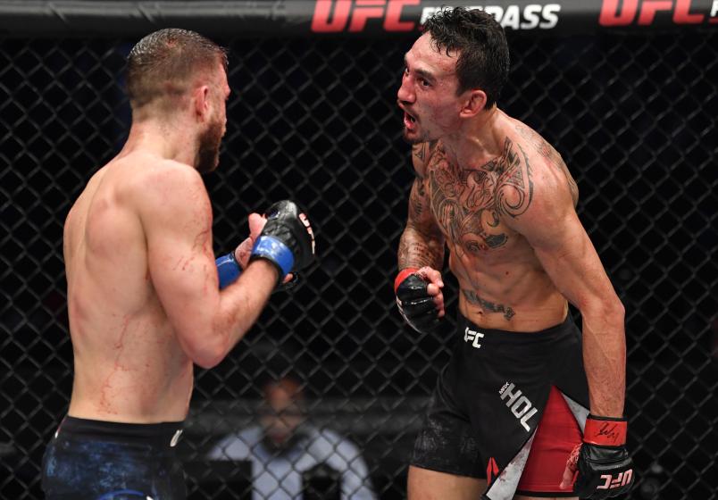 Max Holloway taunts Calvin Kattar in a featherweight bout during the UFC Fight Night event