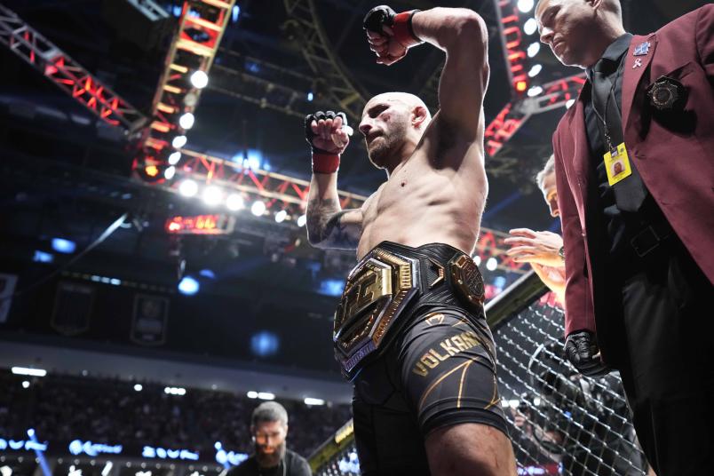 Alexander Volkanovski of Australia celebrates his win in the UFC featherweight championship fight during the UFC 276 event