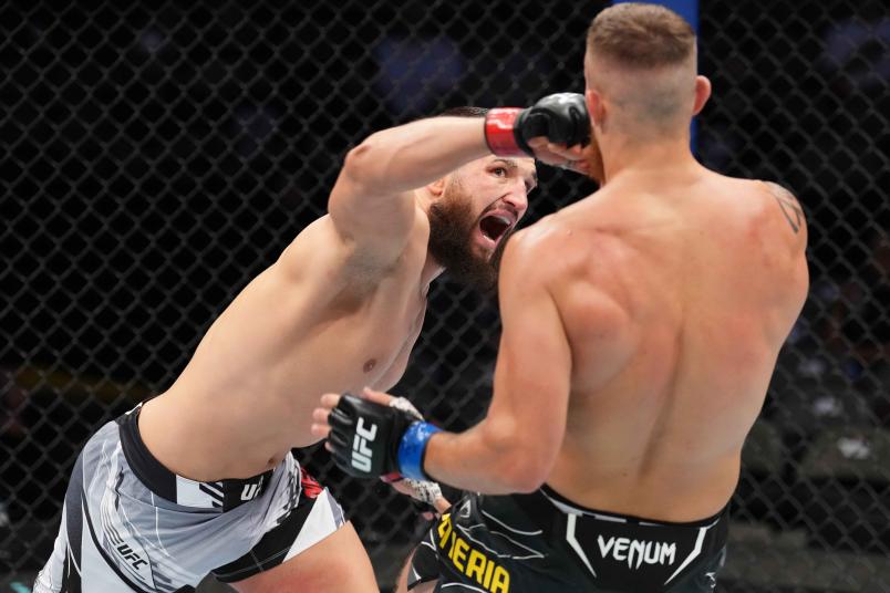 Nicolae Negumereanu of Romania punches Ihor Potieria of Ukraine in a light heavyweight fight during the UFC 277 event