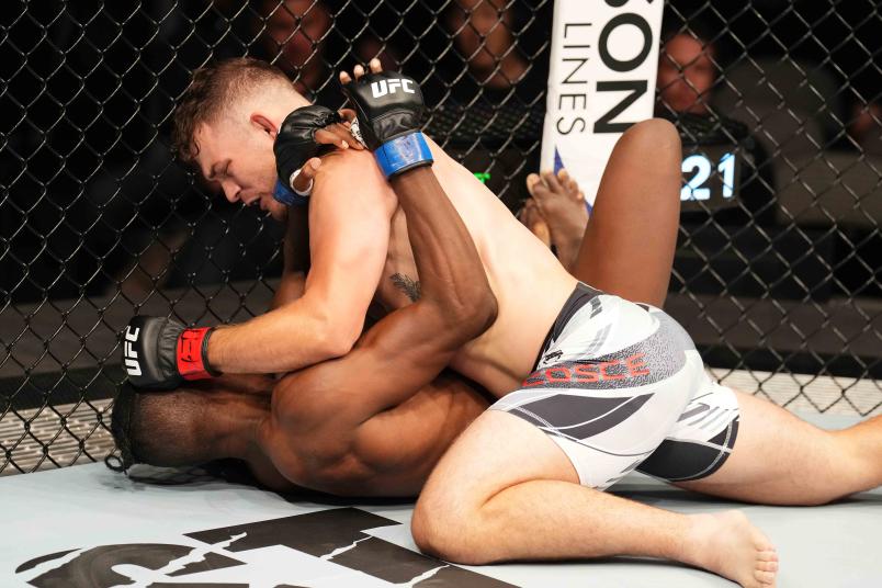 Orion Cosce punches Blood Diamond of Zimbabwe in a welterweight fight during the UFC 277 event