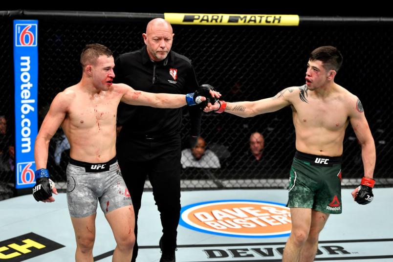 Kai Kara-France of New Zealand touches gloves with Brandon Moreno of Mexico in their flyweight bout during the UFC 245 event at T-Mobile Arena on December 14, 2019 in Las Vegas, Nevada. (Photo by Jeff Bottari/Zuffa LLC)