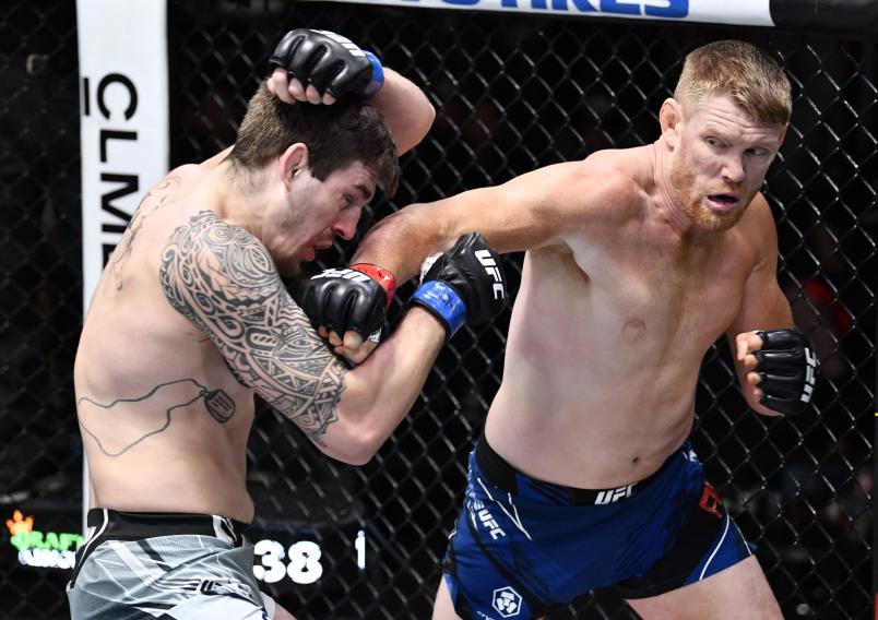 Sam Alvey punches Brendan Allen in their light heavyweight fight during the UFC Fight Night event at UFC APEX