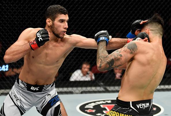 Fares Ziam of France punches Luigi Vendramini of Brazil in their lightweight fight during the UFC 263 event at Gila River Arena on June 12, 2021 in Glendale, Arizona. (Photo by Jeff Bottari/Zuffa LLC)