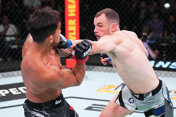 Uroš Medić punches Omar Morales of Venezuela in a lightweight bout during the UFC Fight Night event at UFC APEX on May 21, 2022 in Las Vegas, Nevada. (Photo by Chris Unger/Zuffa LLC)
