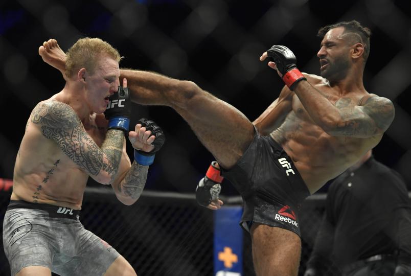 Mike Davis kicks Mason Jones in a lightweight fight during the UFC Fight Night event at Etihad Arena