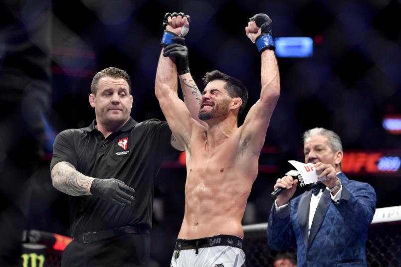 Dominick Cruz reacts after being declared the winner by decision against Pedro Munhoz of Brazil in their bantamweight bout during the UFC 269 event